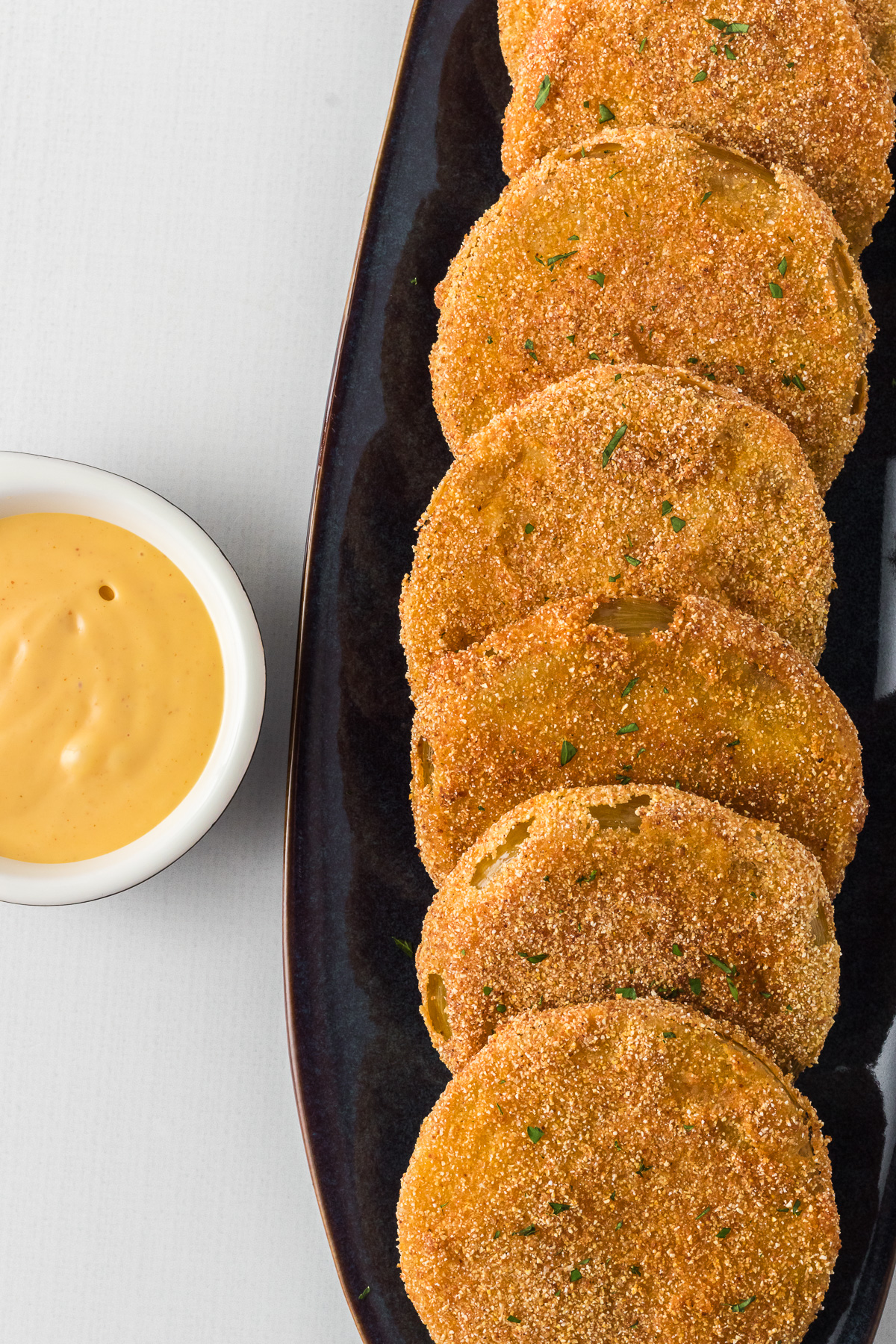 Whether you're a fan of Southern food or just someone looking to try a delicious new dish, Fried Green Tomatoes are the ultimate comfort food with a tangy twist! Enjoy a plate full of these golden brown, crispy, fried green tomatoes for a perfect summer appetizer or side with your favorite Southern meal! via @foodhussy