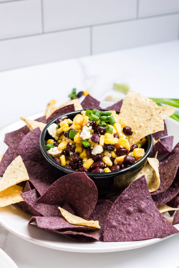 An easy dip appetizer with black beans, corn, and Feta cheese.