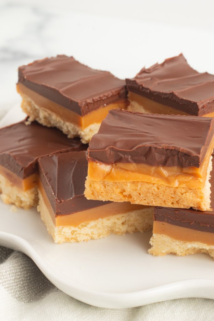 A shortbread cookie with caramel and chocolate.