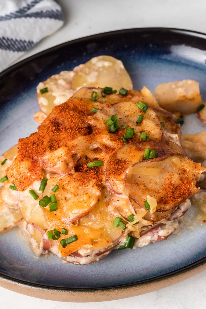 Easy cheesy scalloped potatoes made in a slow cooker.