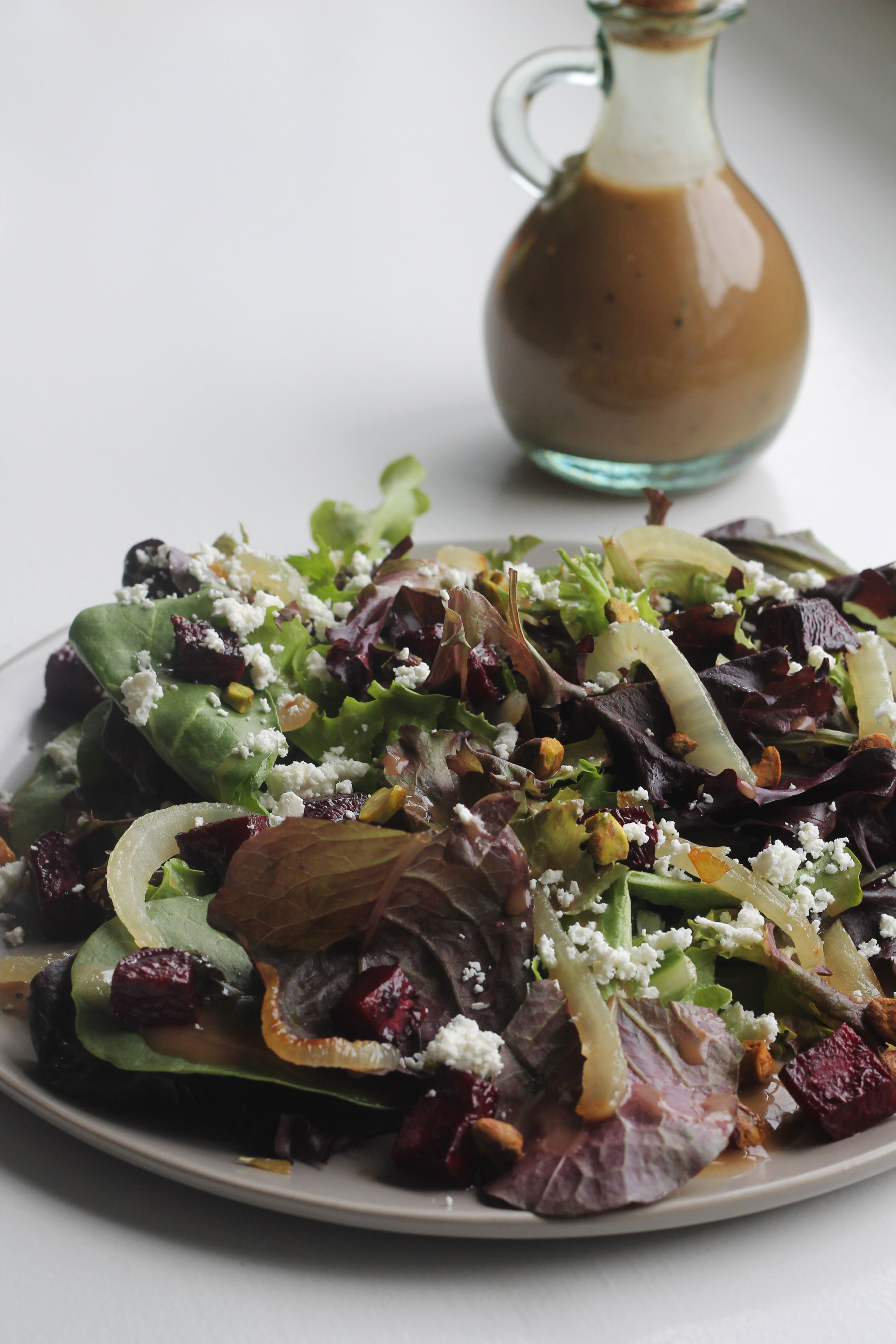 Mixed Greens with Roasted Beets, Caramelized Onions, Goat Cheese and Pistachios tossed in a creamy Balsamic Vinaigrette
