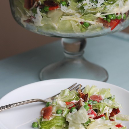 Heading to a potluck or holiday get together? This Seven Layer Salad will be a crowd pleaser