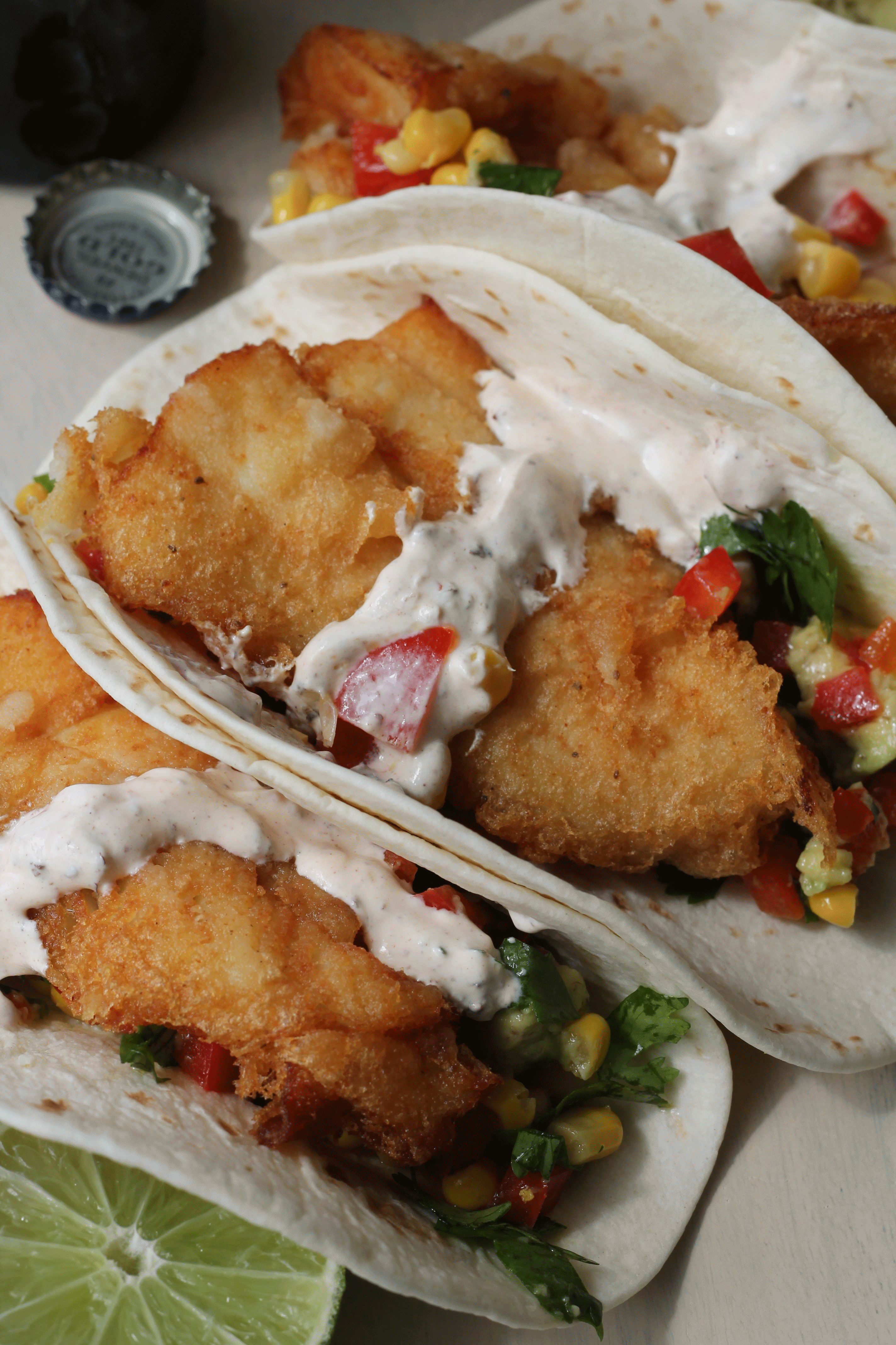 Beer Battered Fish Tacos with Avocado Corn Salsa and Chipotle Sour Cream