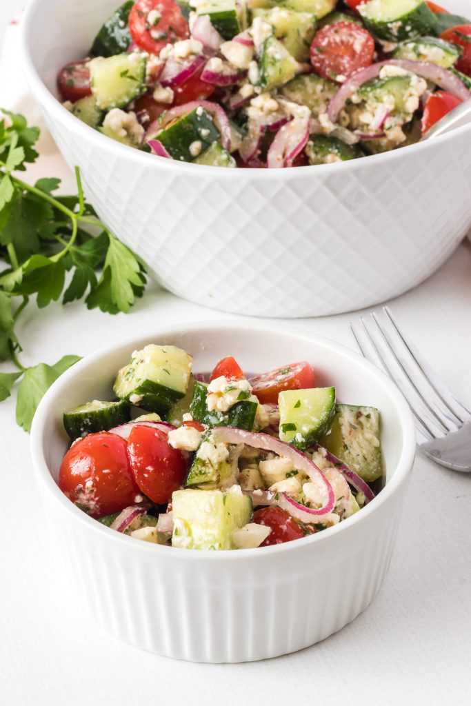 A light salad with cucumber, tomato, red onion and feta cheese in a vinaigrette.