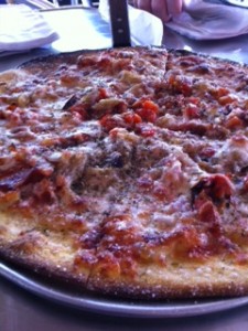 The New Amory Pizza with Pancetta, Caramelized Onions, Roasted Red Peppers, Marinara, Mozzarella