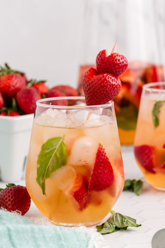 A glass of Strawberry and Basil Sangria.