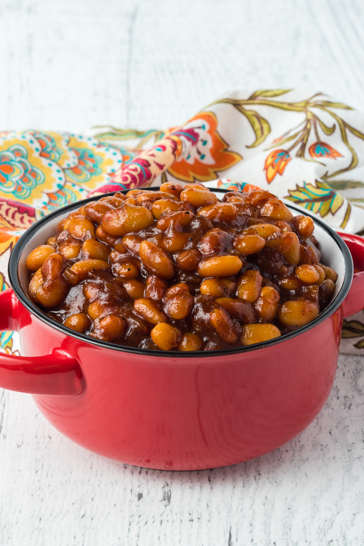 Sweet and savory Baked Beans are the perfect side dish for summer potlucks, backyard BBQs, and even a great family dinner when camping! Made with Great Northern Beans, molasses, ketchup, BBQ sauce, brown sugar and more, this easy bean recipe is bursting with flavor in every bite. via @foodhussy