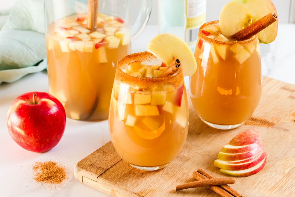 Glasses of Cider Sangria with apple.