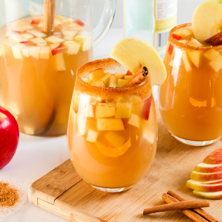 Glasses of Cider Sangria with apple.