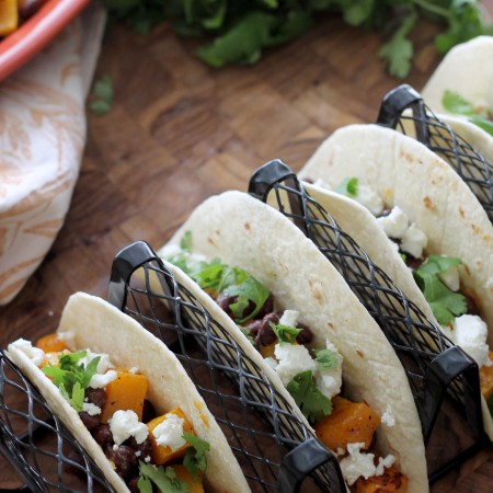 Butternut Squash and Black Bean Tacos will become your new go to meal! Full of flavor by being tossed in a smoky vinaigrette and topped with tangy goat cheese and cilantro