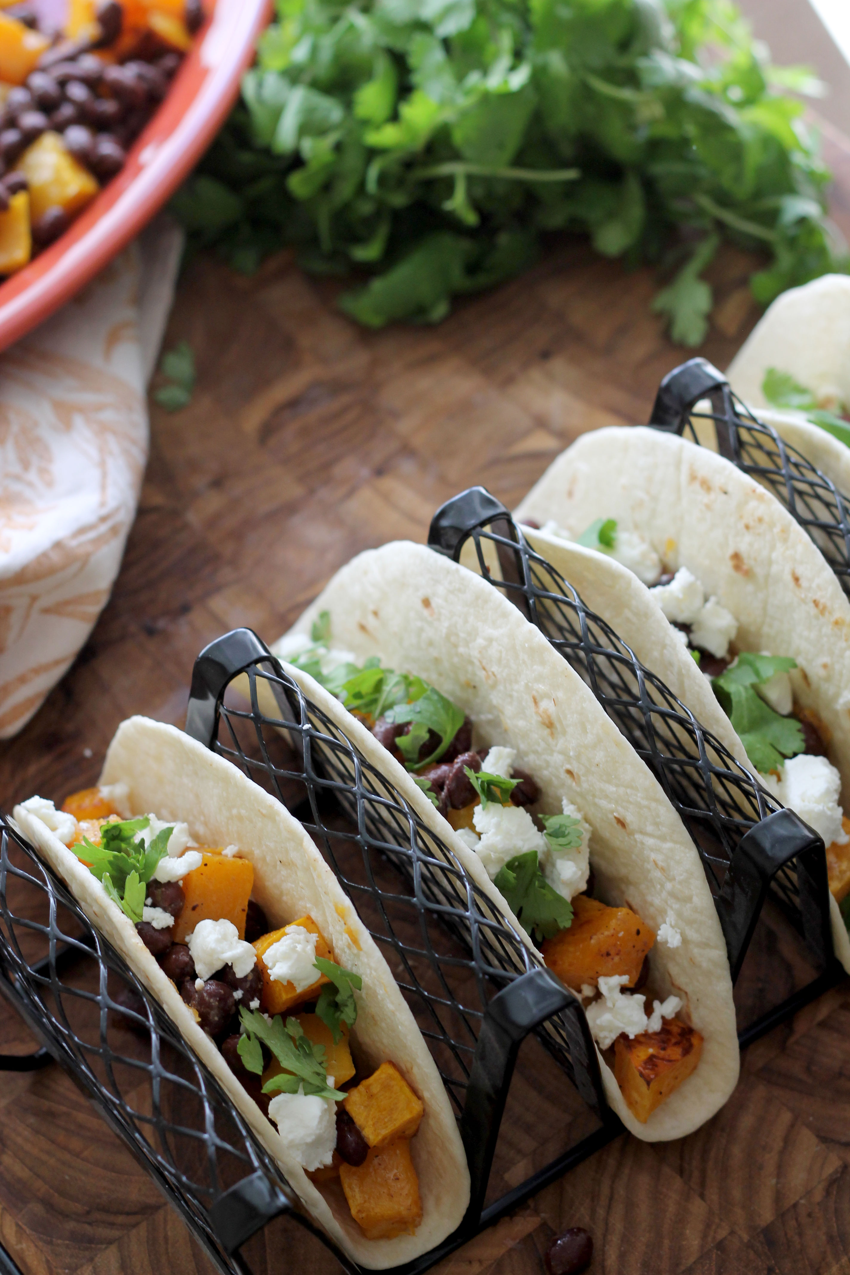 Butternut Squash and Black Bean Tacos will become your new go to meal! Full of flavor by being tossed in a smoky vinaigrette and topped with tangy goat cheese and cilantro