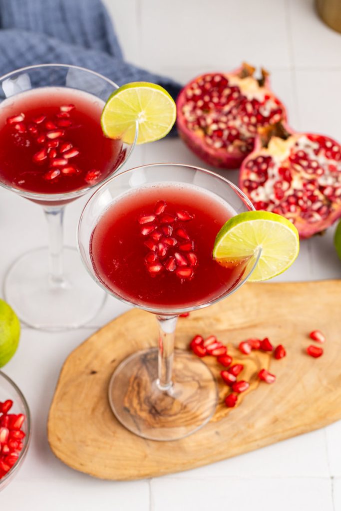 A martini with lime and pomegranate juice.