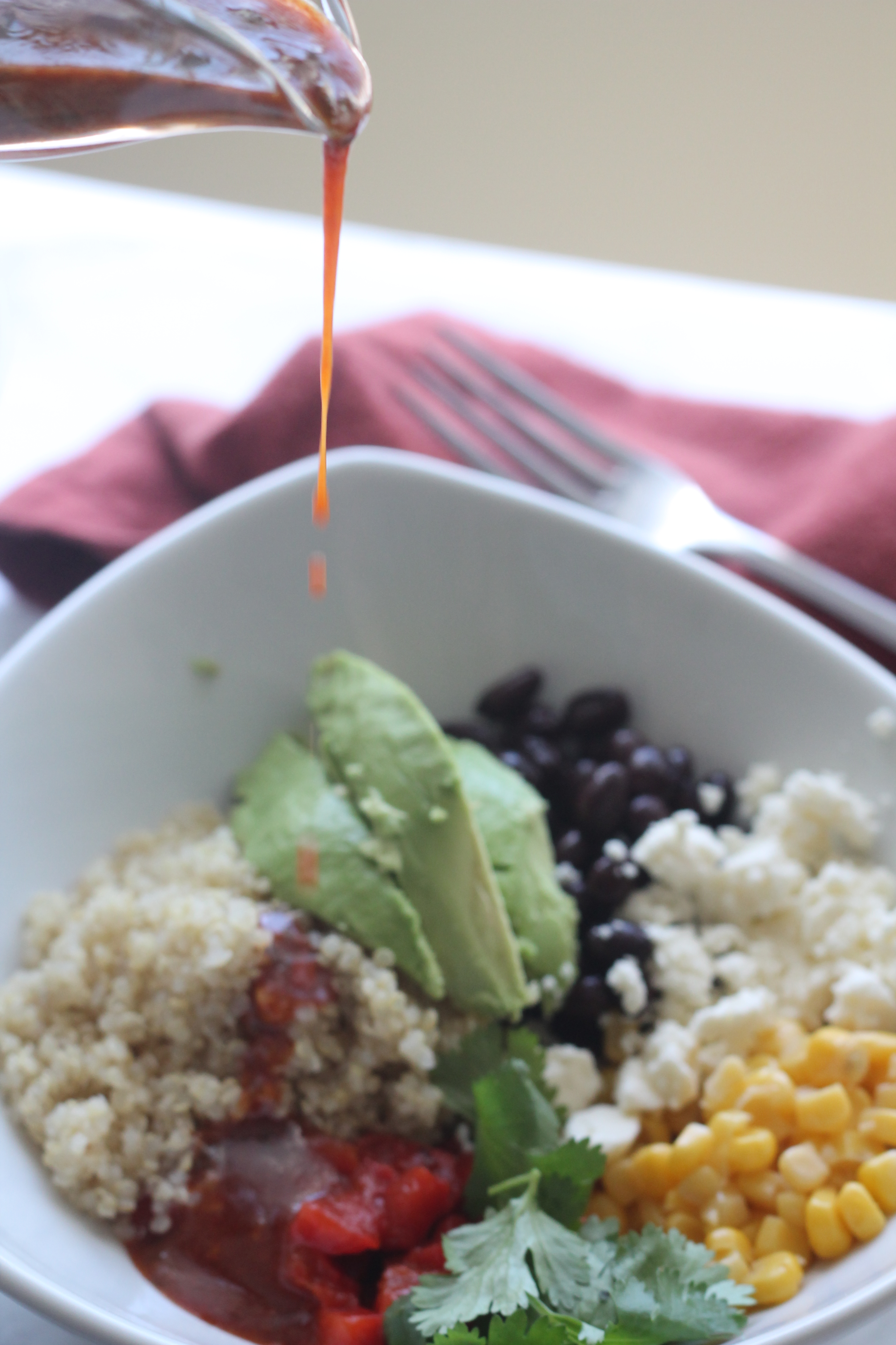Quinoa topped with black beans, corn, roasted red peppers, avocado and feta then drizzled in a smoky southwestern vinaigrette