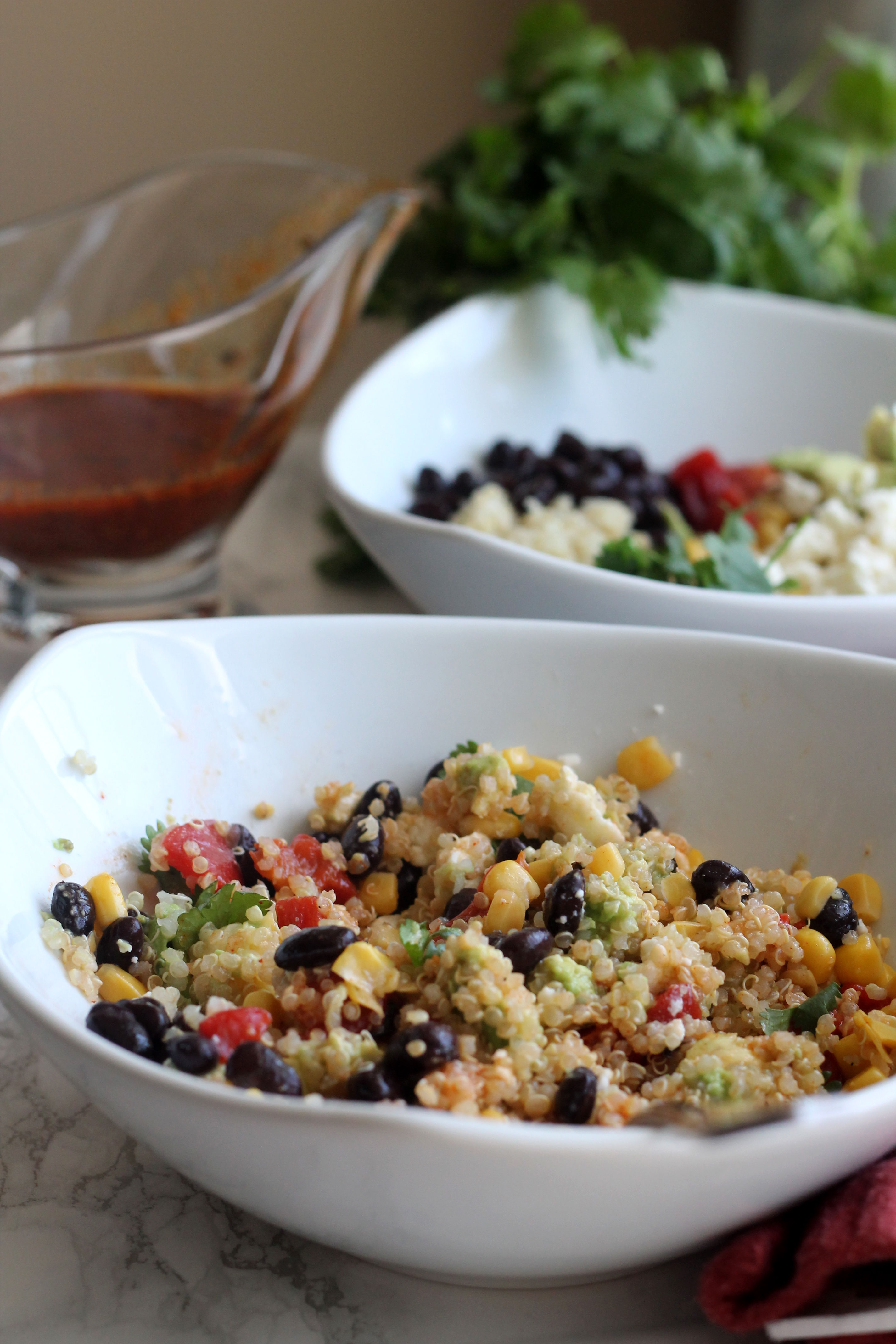 Southwestern Quinoa Bowl - veggies, beans, and cheese tossed in a smoky vinaigrette