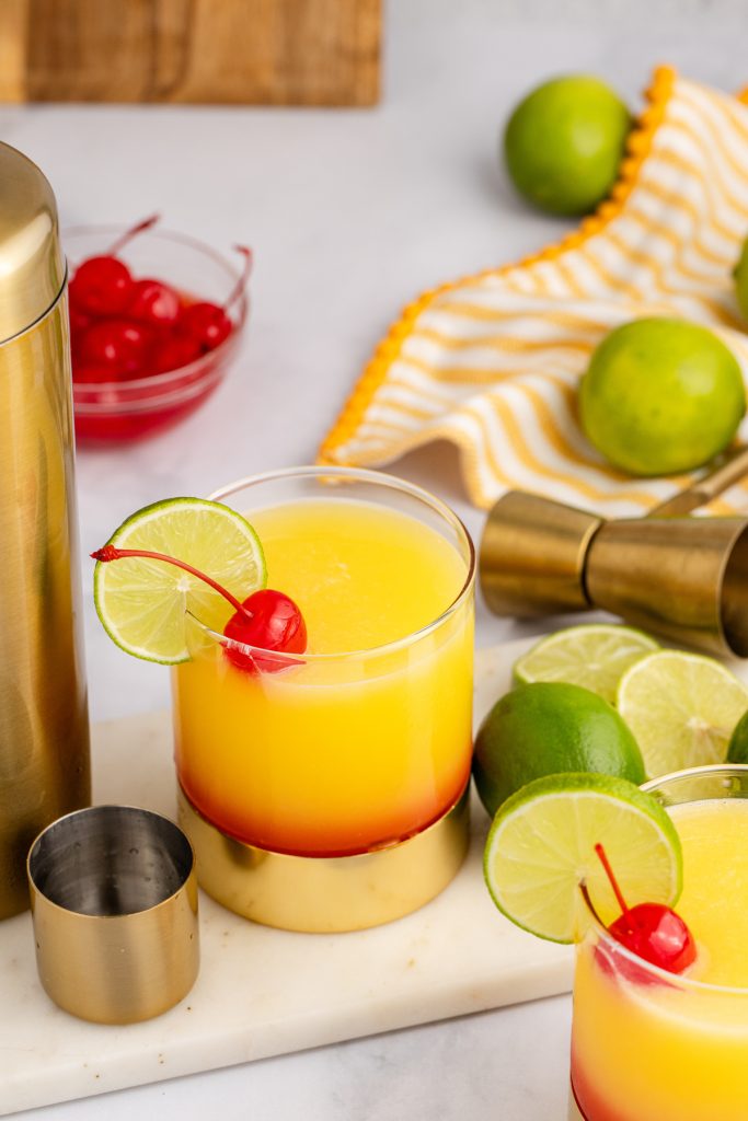 A combination cocktail of a margarita and a tequila sunrise.