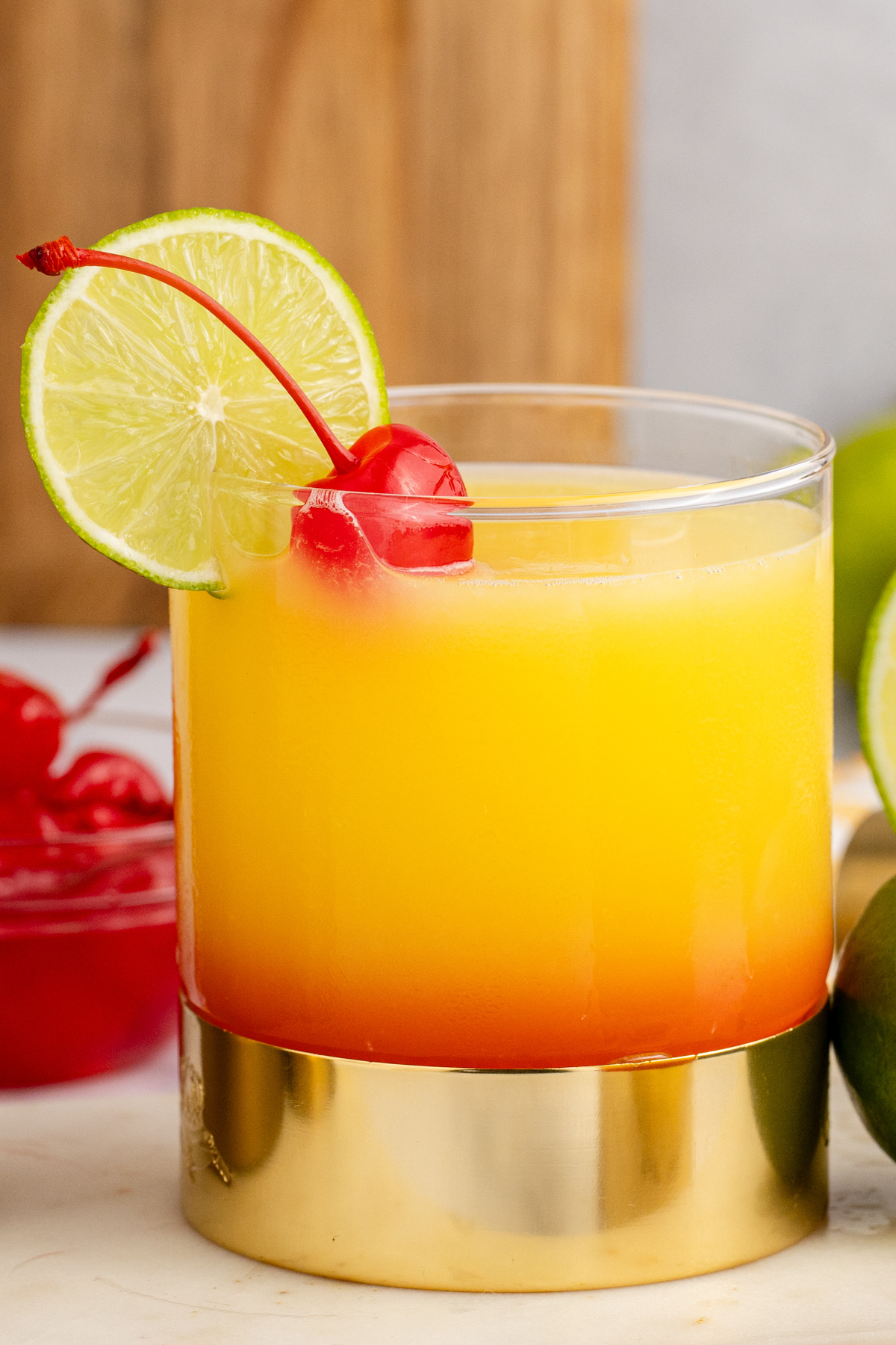 This recipe for Tequila Sunrise Margaritas combines two classic cocktails into one delicious drink. Enjoy the fresh and fruity flavors of a Tequila Sunrise cocktail with the sharp citrus notes of a regular margarita.  Make this delicious drink for your fiesta tonight! via @foodhussy