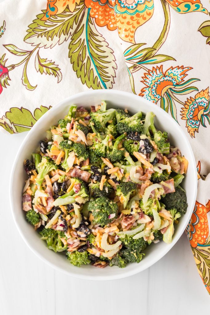 An easy summer salad made of broccoli, nuts, fruit, and cheese.