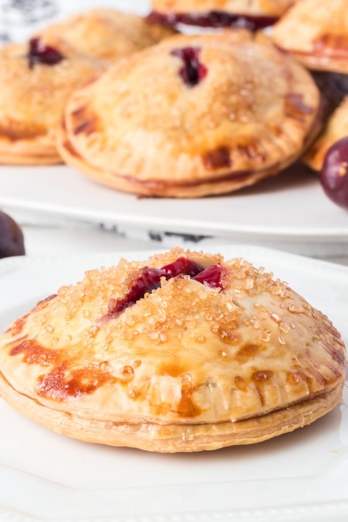 A hand pie made with homemade cherry filling and store bought pie crusts.
