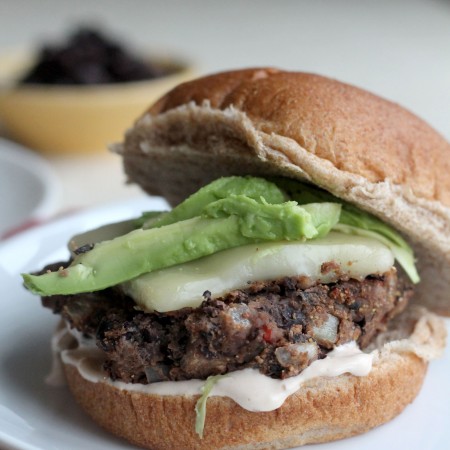 These Black Bean Burgers are full of flavor and topped with a chipotle mayo sauce, avocado, and Monterey Jack cheese