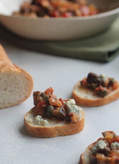 Eggplant, tomatoes, onions, and capers give this delicious bruschetta a twist!