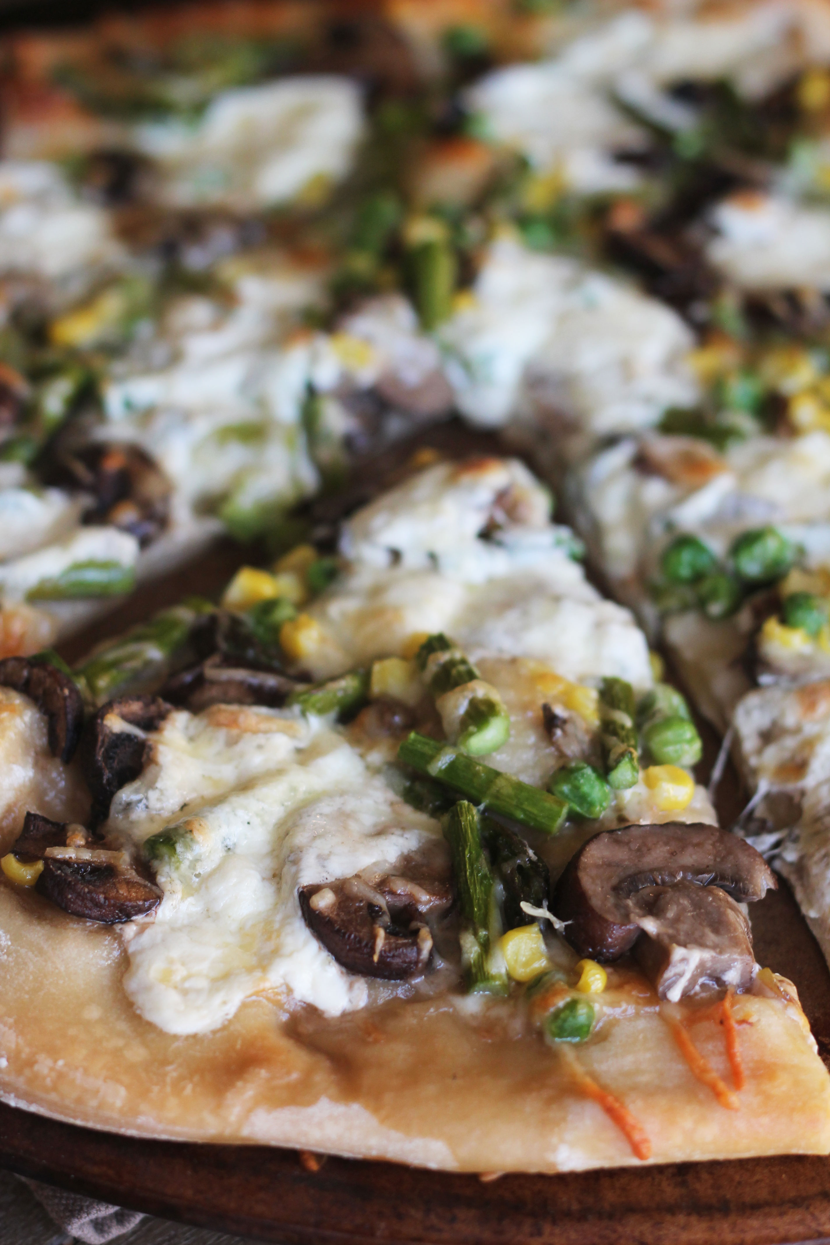 This pizza is packed full of your favorite spring vegetables