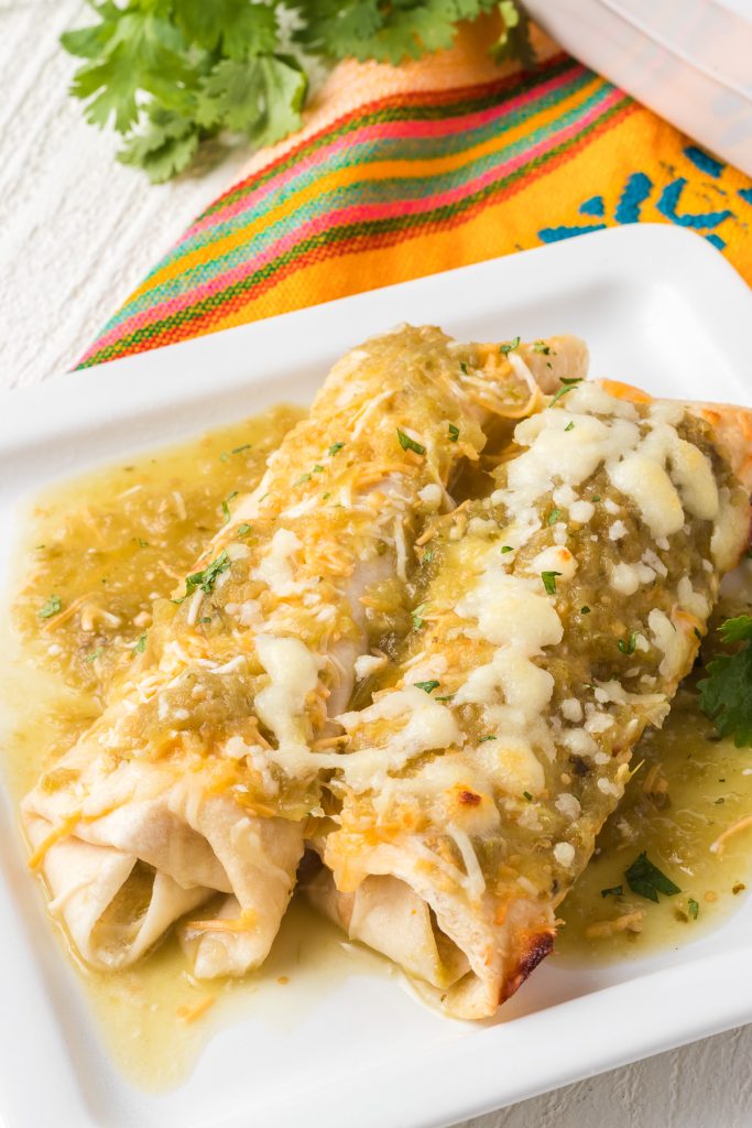 Enchiladas made with cheese, chicken and a green salsa.