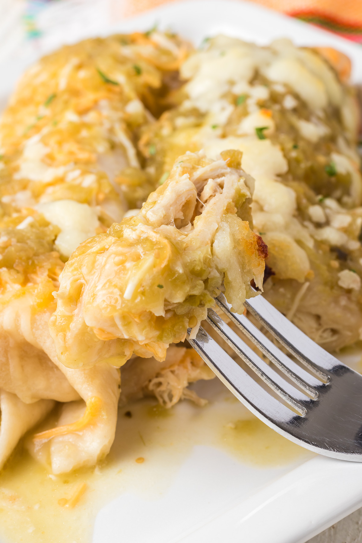 These Cheesy Chicken Enchiladas are saucy, cheesy, and downright delicious. If there's one thing we can all agree on, it's that gooey melted cheese makes everything better, and when it blankets tender, seasoned chicken rolled up in warm tortillas and smothered in zesty enchilada sauce, well, you've just hit the culinary jackpot. via @foodhussy