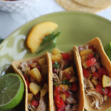 Summertime means peaches. So how about some Slow Cooker Beer Chicken Tacos with Peach Salsa