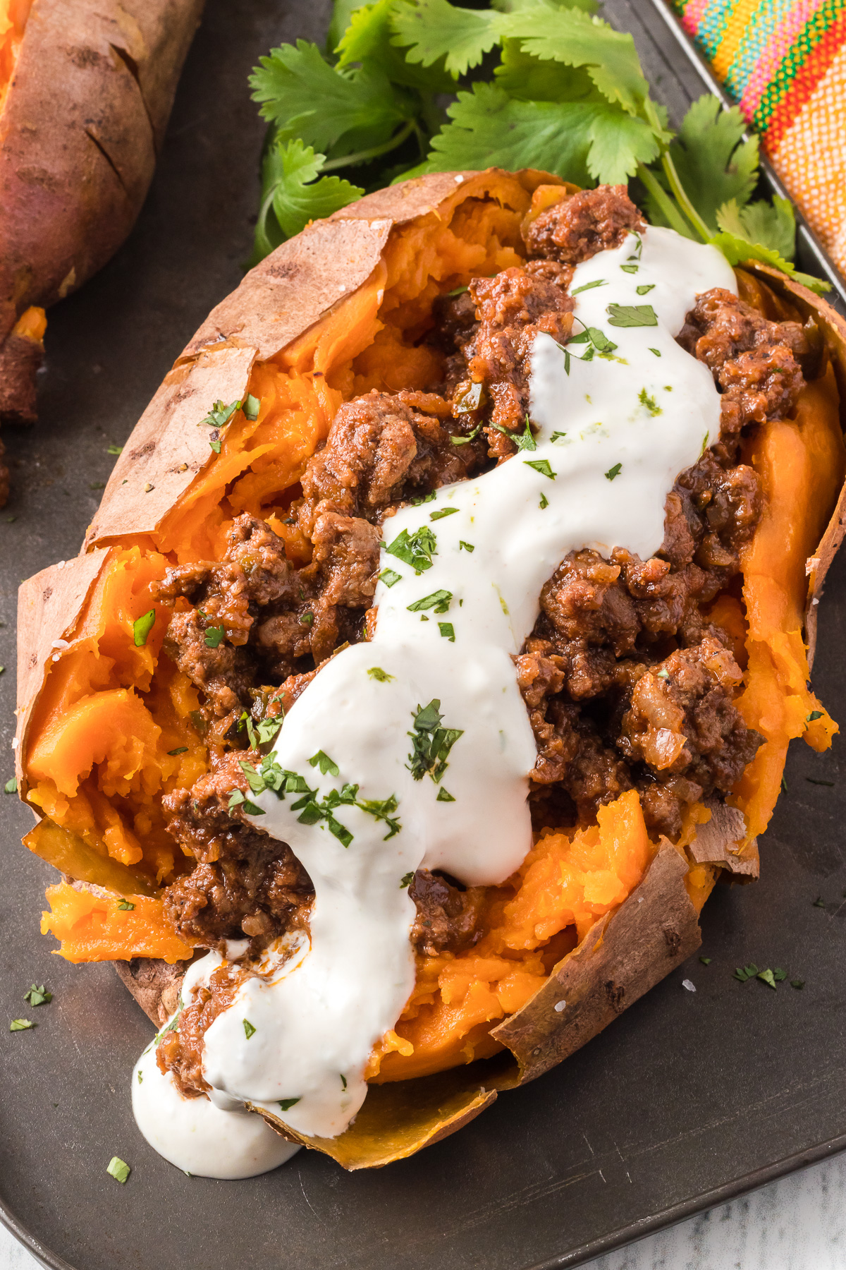 Our Mexican Sloppy Joe Sweet Potatoes are made with ground beef, homemade taco seasoning, and your favorite ingredients for a delicious twist on an old favorite. Sweet potatoes provide a perfect “shell” for these filling, flavorful tacos. So skip the take-out and try something new for dinner tonight! via @foodhussy