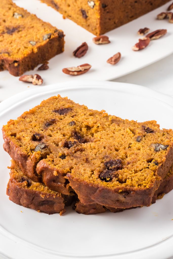 Slices of an easy quick bread made of pumpkin, chocolate chips and pecans.