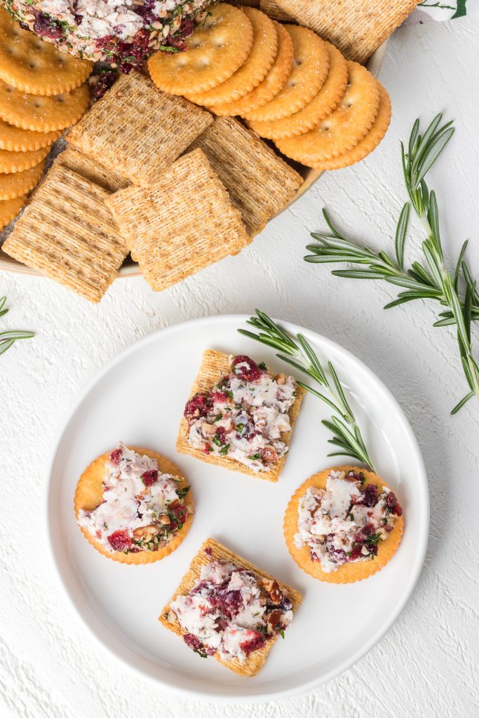 Cracker with cream and cheddar cheeses, pecans and dried cranberries.