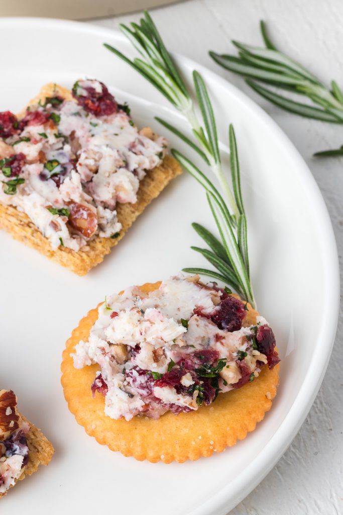 Cheese spread from a ball on crackers.