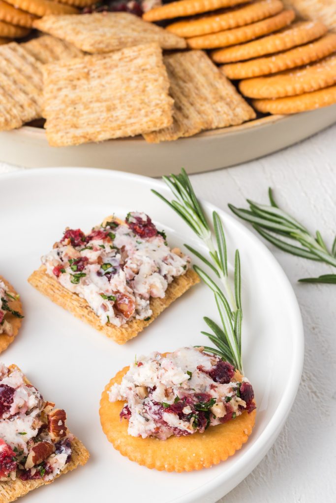 Bits of pecans, dried cranberries, parsley and rosemary make this easy holiday appetizer.