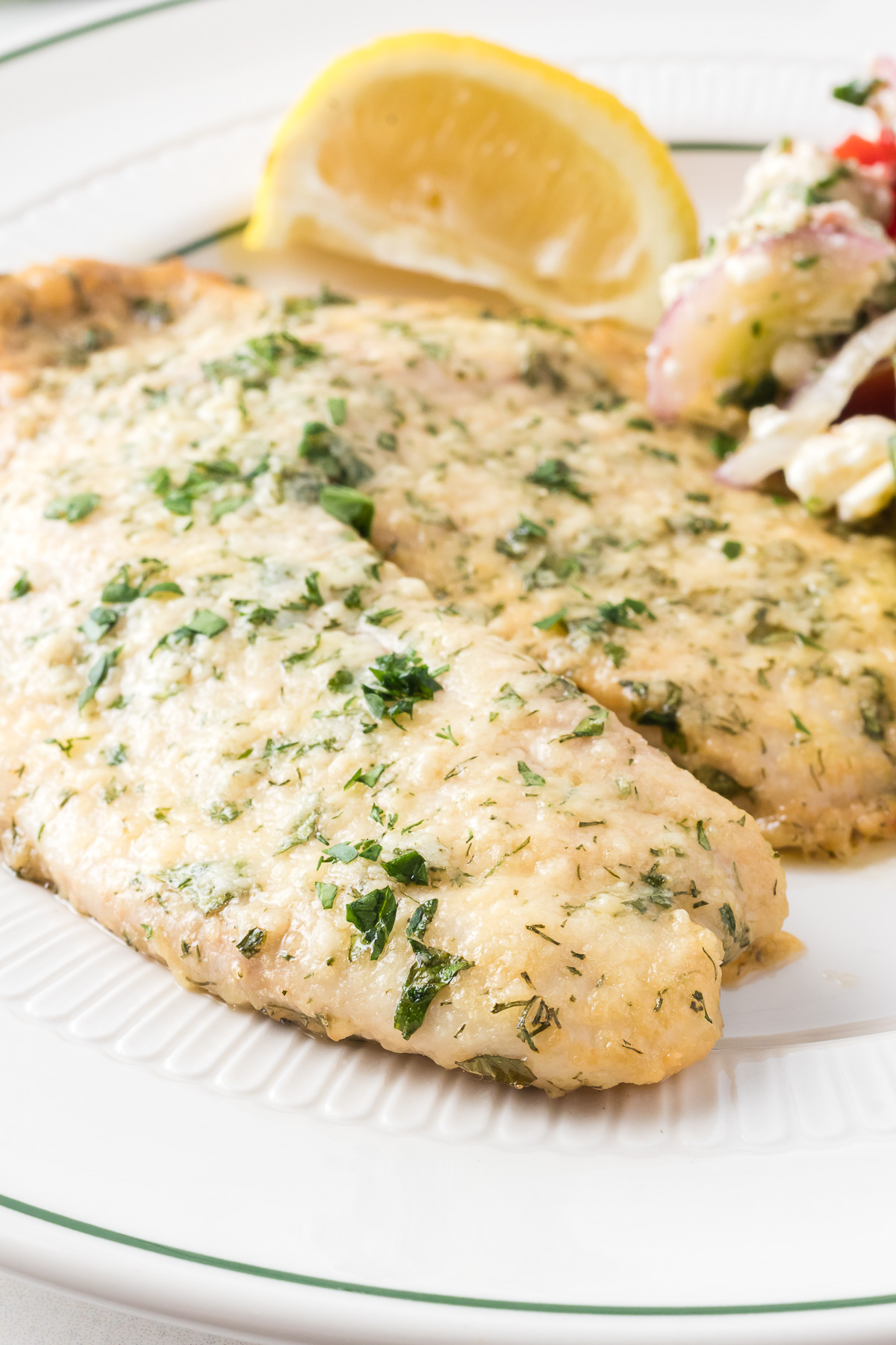 This Parmesan Tilapia is an easy low-carb option for dinner with a cooking time under 20 minutes. It's amazing what a little olive oil, fresh herbs, and freshly grated cheese can do to spice up a simple piece of fish! This recipe is perfect for a busy weeknight meal, and it’s light and full of flavor. How can you say no to that? via @foodhussy