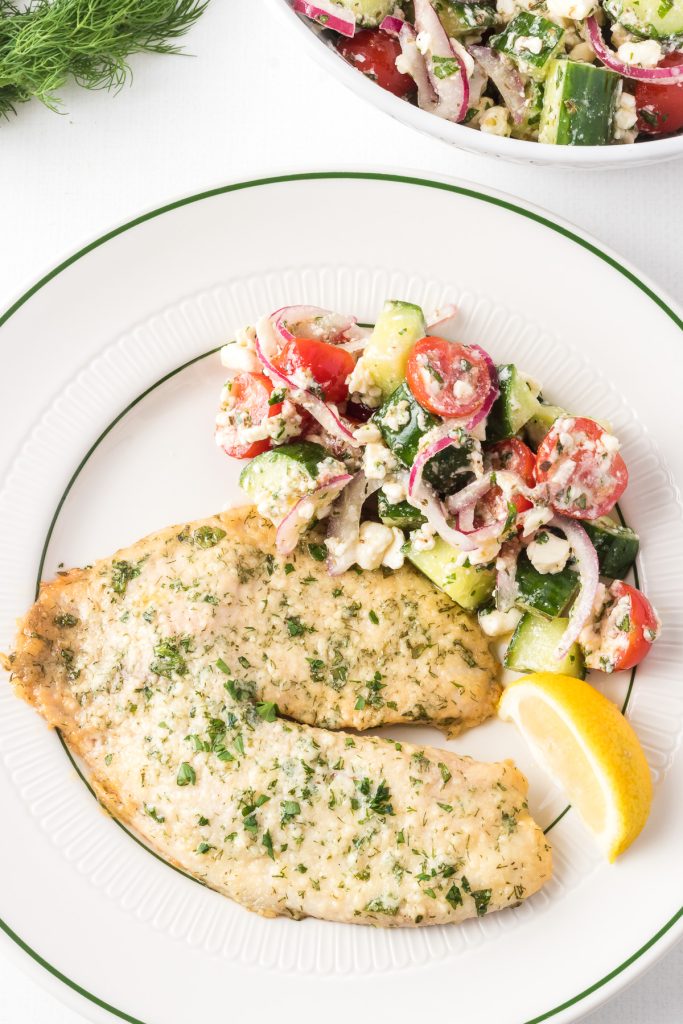 Parmesan cheese and fresh herbs coat tilapia fillets for an easy dinner that's ready in 20 minutes.