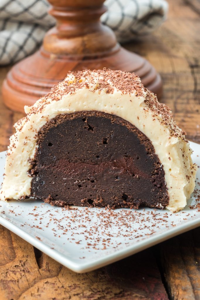 A slice of chocolate cake with chocolate ganache and Irish Cream frosting.