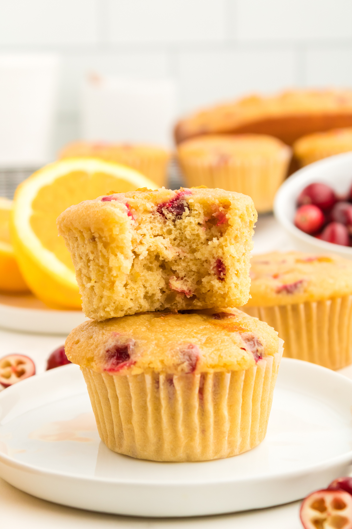 These Orange Cranberry Muffins are so easy to make and the perfect addition to any morning breakfast. Bursting with fresh cranberries and full of orange flavor from both orange juice and zest, these incredible muffins deserve to be eaten all year long and not just during the holidays! via @foodhussy