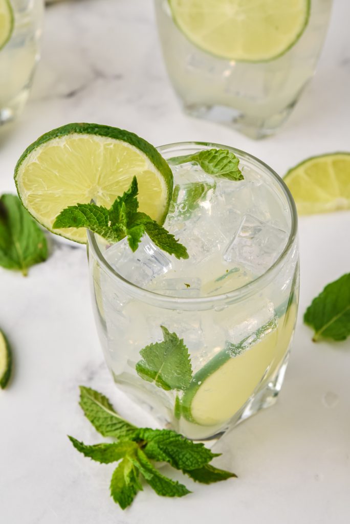A cocktail made with lime, fresh mint, rum, and sugar.