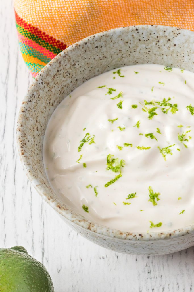 Sriracha, lime juice and zest in a sour cream sauce.