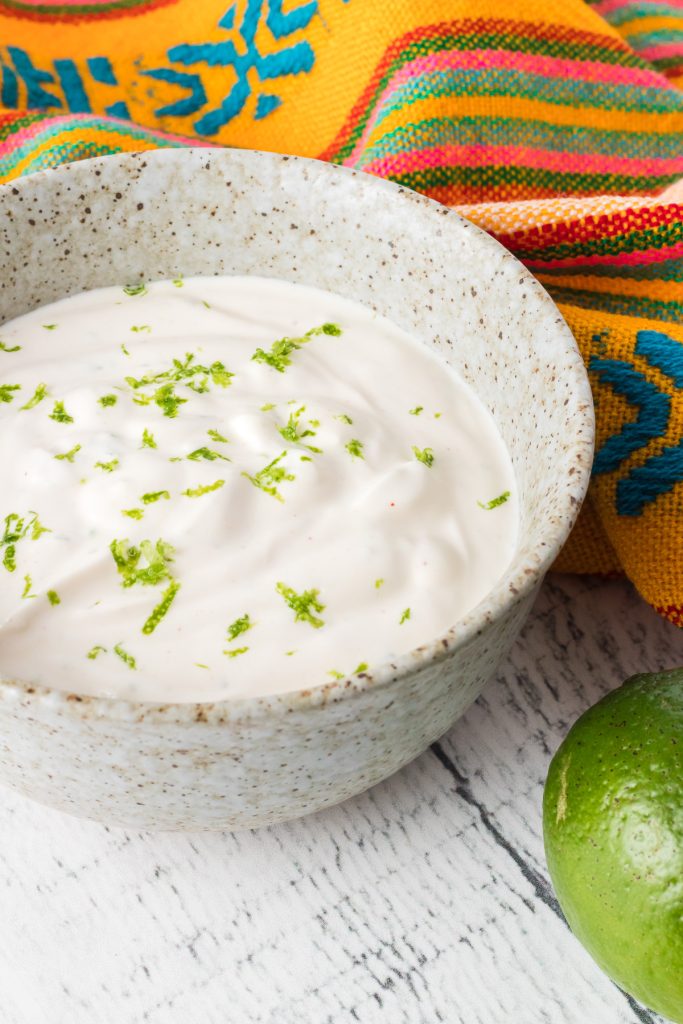 An easy condiment made with lime juice, zest, Sriracha, and sour cream.